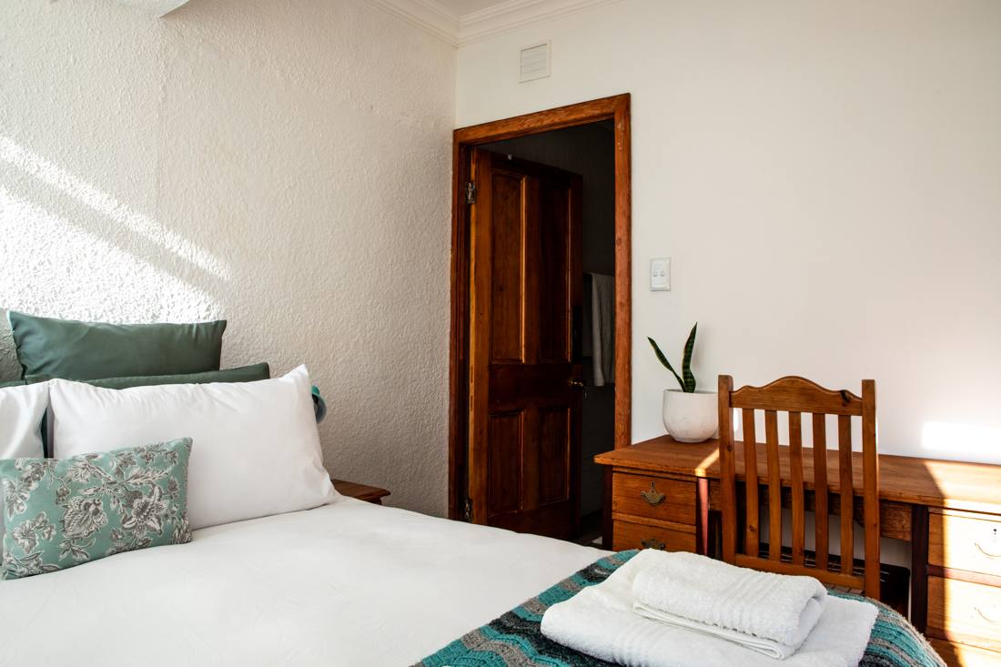 Bedroom 1 with double bed and desk