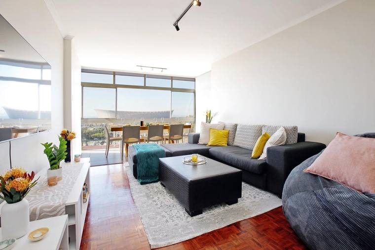 Living room with stadium views beyond the dining table