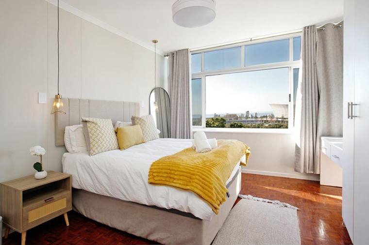 Bedroom with queen bed and sea views