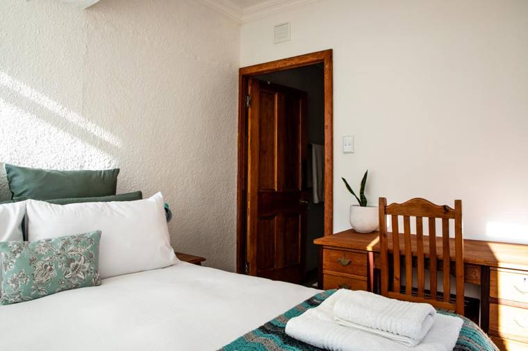 Bedroom 1 with double bed and desk